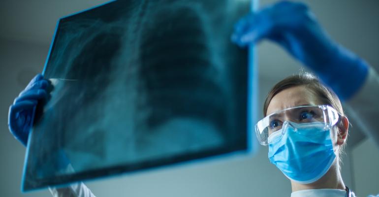 female-doctor-examining-chest-xray.jpg